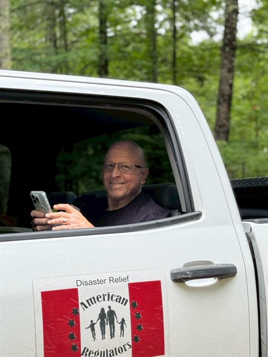 A team member in the American Regulators disaster relief truck