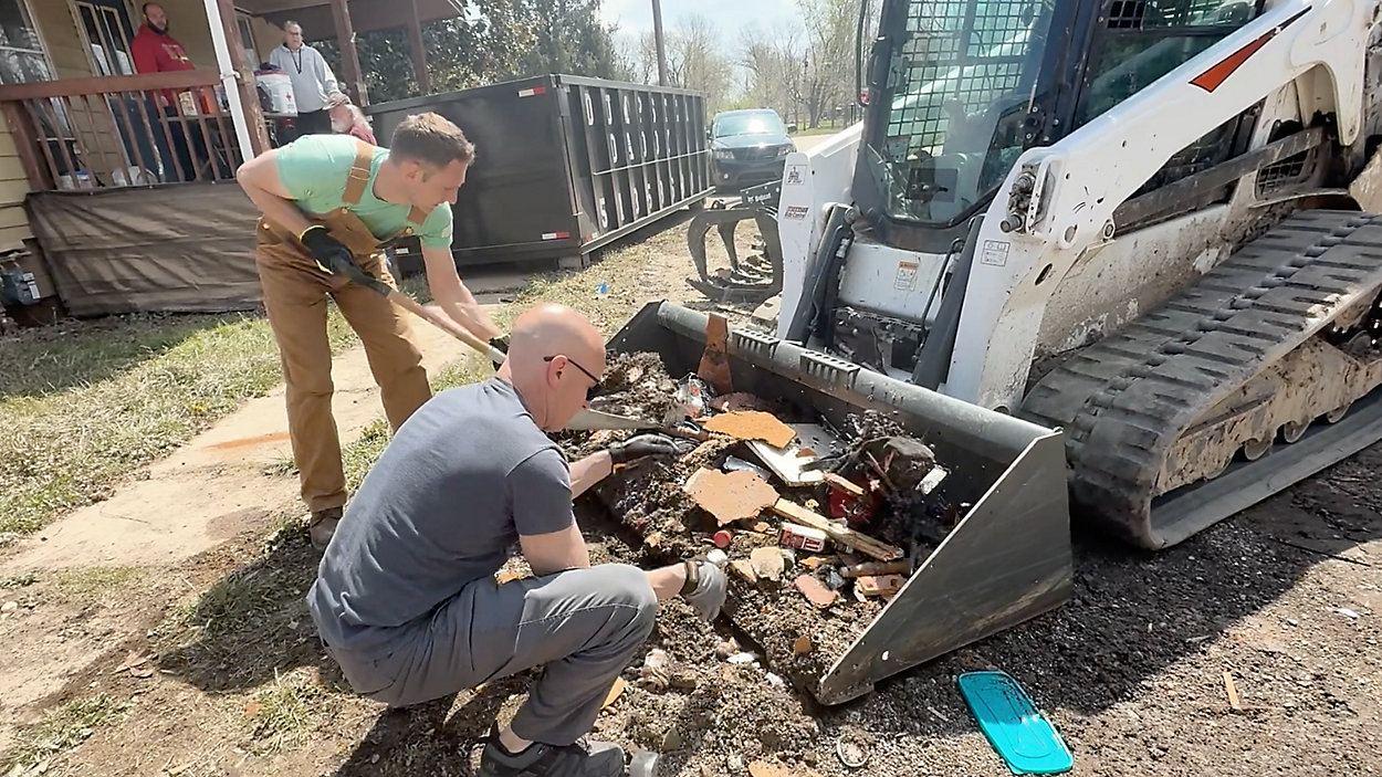 Spectrum News 1: volunteers and business owners clean up Front Street in New Richmond, Ohio after the April 2025 flood
